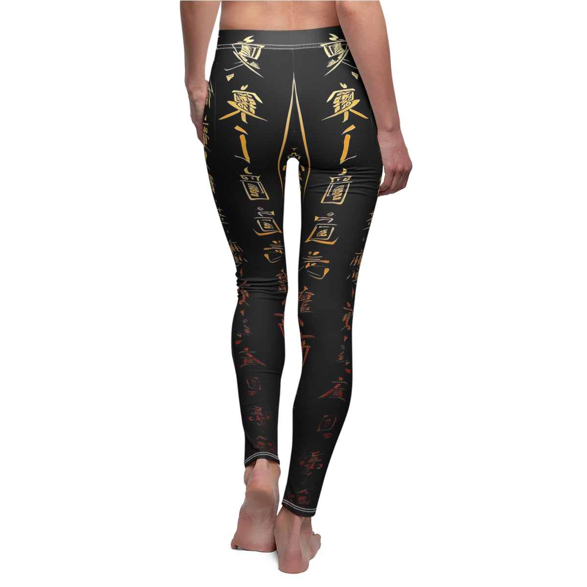 A pair of skinny fit leggings featuring gold and red Chinese lettering on a black background, worn by model, back view.